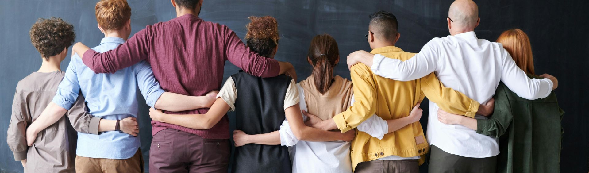 Group of People Standing Indoors