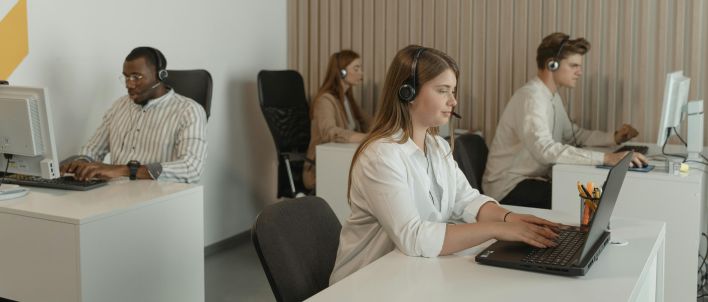 Four People Working in Call Center Office